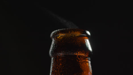 Close-Up-Of-Condensation-Droplets-On-Neck-Of-Bottle-Of-Cold-Beer-Or-Soft-Drink-With-Water-Vapour-After-Opening-1